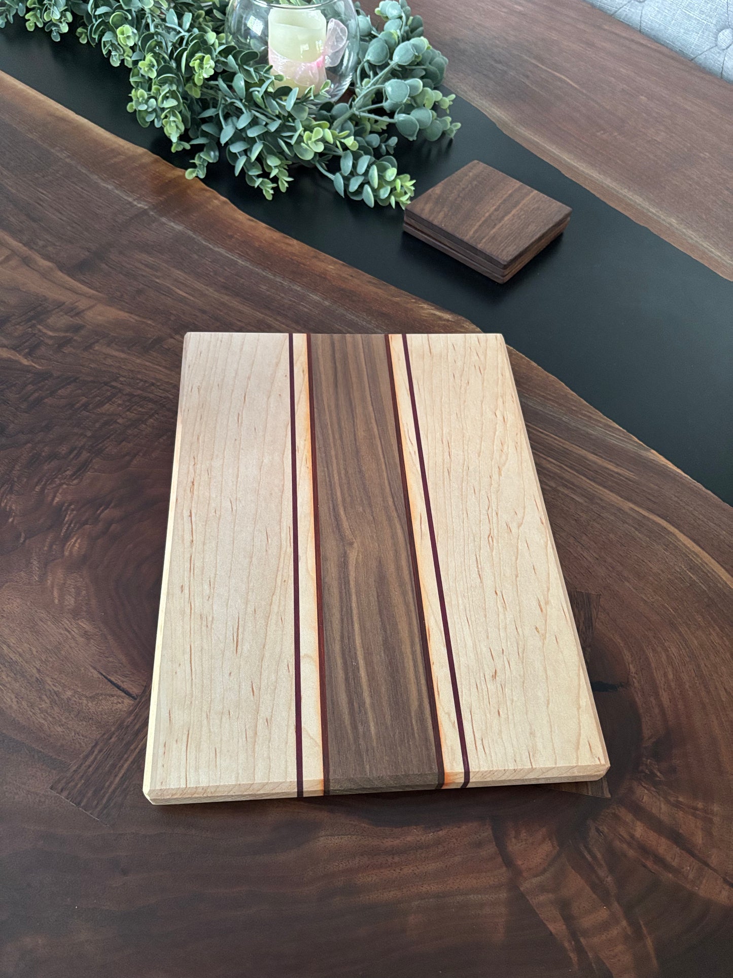 Black walnut/maple with padauk and Purple Heart strips