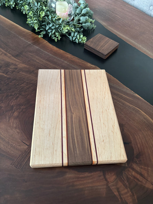 Black walnut/maple with padauk and Purple Heart strips